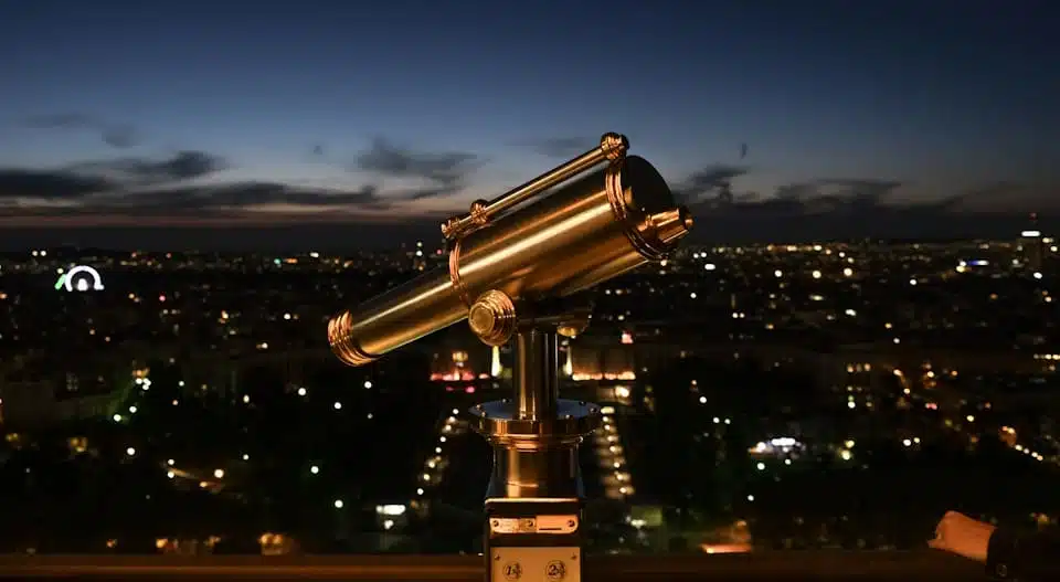 telescope at eiffel tower at night